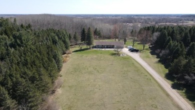 Welcome to 3787 Buzzell Rd. This beautifully updated 4-bedroom on Gladwin Heights Golf Course in Michigan - for sale on GolfHomes.com, golf home, golf lot