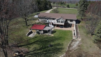 Welcome to 3787 Buzzell Rd. This beautifully updated 4-bedroom on Gladwin Heights Golf Course in Michigan - for sale on GolfHomes.com, golf home, golf lot