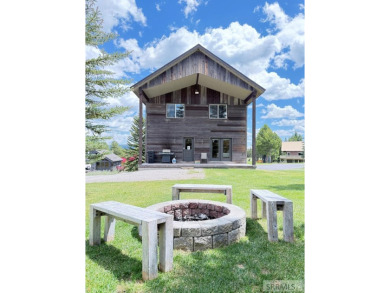 Stunning cabin in Island Park where rustic elegance meets on Island Park Village Resort Golf Course in Idaho - for sale on GolfHomes.com, golf home, golf lot
