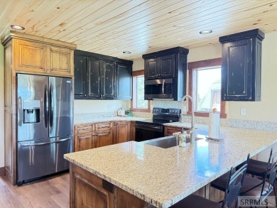Stunning cabin in Island Park where rustic elegance meets on Island Park Village Resort Golf Course in Idaho - for sale on GolfHomes.com, golf home, golf lot
