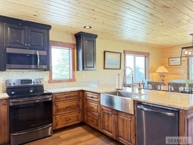 Stunning cabin in Island Park where rustic elegance meets on Island Park Village Resort Golf Course in Idaho - for sale on GolfHomes.com, golf home, golf lot