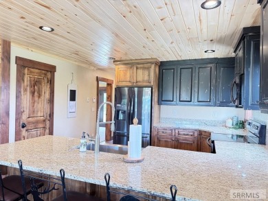 Stunning cabin in Island Park where rustic elegance meets on Island Park Village Resort Golf Course in Idaho - for sale on GolfHomes.com, golf home, golf lot