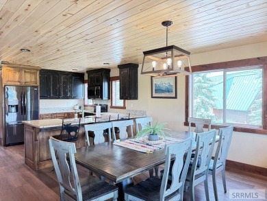 Stunning cabin in Island Park where rustic elegance meets on Island Park Village Resort Golf Course in Idaho - for sale on GolfHomes.com, golf home, golf lot