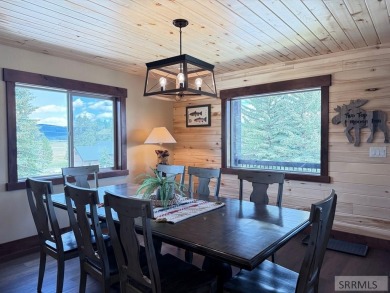 Stunning cabin in Island Park where rustic elegance meets on Island Park Village Resort Golf Course in Idaho - for sale on GolfHomes.com, golf home, golf lot