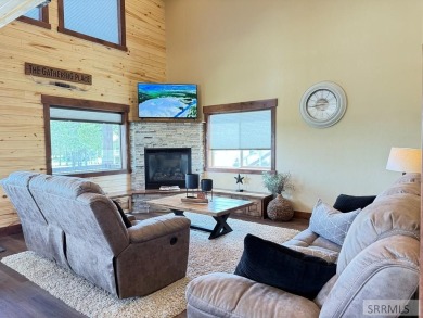 Stunning cabin in Island Park where rustic elegance meets on Island Park Village Resort Golf Course in Idaho - for sale on GolfHomes.com, golf home, golf lot
