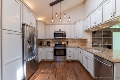 Located in the iconic Tan Tar A Estates, just steps from on The Oaks Golf Course in Missouri - for sale on GolfHomes.com, golf home, golf lot