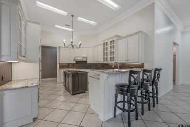 Located in Hollytree, this stunning home offers 4 spacious on Hollytree Country Club in Texas - for sale on GolfHomes.com, golf home, golf lot