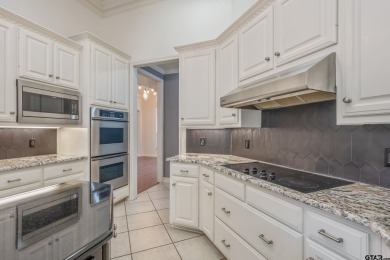Located in Hollytree, this stunning home offers 4 spacious on Hollytree Country Club in Texas - for sale on GolfHomes.com, golf home, golf lot