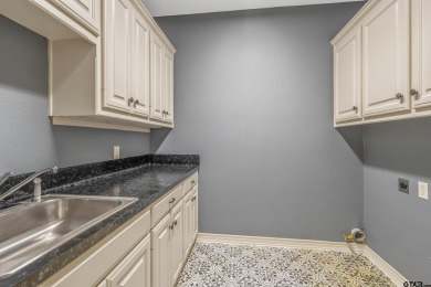 Located in Hollytree, this stunning home offers 4 spacious on Hollytree Country Club in Texas - for sale on GolfHomes.com, golf home, golf lot