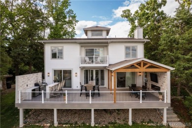 Nestled in the coveted Black Hawk Estates on a scenic bluff with on Seasons Ridge At Four Seasons in Missouri - for sale on GolfHomes.com, golf home, golf lot