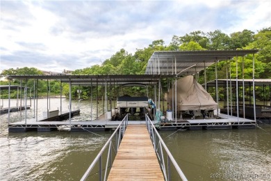 Nestled in the coveted Black Hawk Estates on a scenic bluff with on Seasons Ridge At Four Seasons in Missouri - for sale on GolfHomes.com, golf home, golf lot