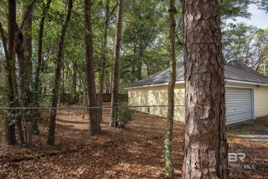 Full of southern charm, this beautiful 3-bedroom, 2-bath cottage on Lake Forest Yacht and Country Club in Alabama - for sale on GolfHomes.com, golf home, golf lot