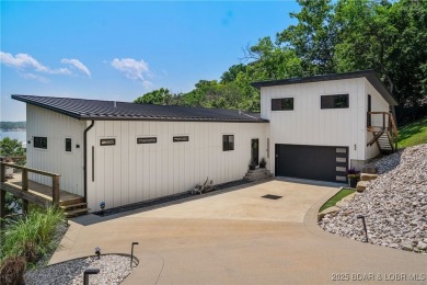 The views from this modernly constructed lakefront home are on Seasons Ridge At Four Seasons in Missouri - for sale on GolfHomes.com, golf home, golf lot