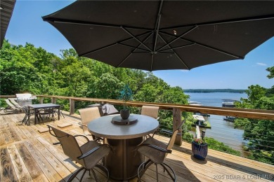 The views from this modernly constructed lakefront home are on Seasons Ridge At Four Seasons in Missouri - for sale on GolfHomes.com, golf home, golf lot