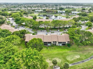 Light and bright second floor unit overlooking the golf course on Boca Delray Golf and Country Club in Florida - for sale on GolfHomes.com, golf home, golf lot