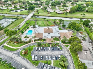 Light and bright second floor unit overlooking the golf course on Boca Delray Golf and Country Club in Florida - for sale on GolfHomes.com, golf home, golf lot