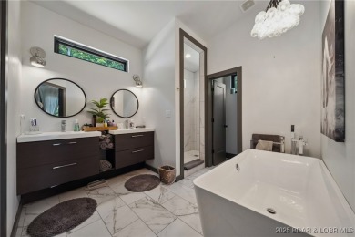 The views from this modernly constructed lakefront home are on Seasons Ridge At Four Seasons in Missouri - for sale on GolfHomes.com, golf home, golf lot