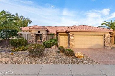 Experience resort-style living with this elegant home offering on Sun City Grand Golf Couse and Club in Arizona - for sale on GolfHomes.com, golf home, golf lot