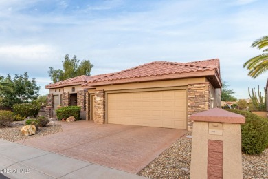 Experience resort-style living with this elegant home offering on Sun City Grand Golf Couse and Club in Arizona - for sale on GolfHomes.com, golf home, golf lot