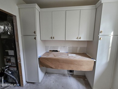 Tucked beneath the live oaks of the Bald Head Island Maritime on Bald Head Island Golf Club in North Carolina - for sale on GolfHomes.com, golf home, golf lot