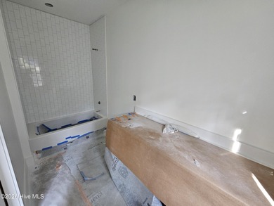 Tucked beneath the live oaks of the Bald Head Island Maritime on Bald Head Island Golf Club in North Carolina - for sale on GolfHomes.com, golf home, golf lot