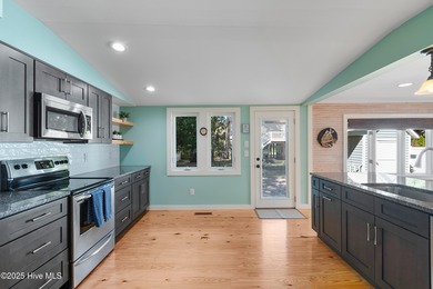 Location, Location, Location! This charming coastal cottage is on Founders Club At St. James Plantation in North Carolina - for sale on GolfHomes.com, golf home, golf lot