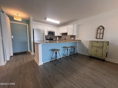 This spacious second-story unit offers unparalleled views of on Bay Point Resort Golf Club in Florida - for sale on GolfHomes.com, golf home, golf lot