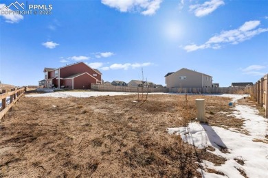 This 2022-built Challenger home in the Bent Grass community sits on Antler Creek Golf Course in Colorado - for sale on GolfHomes.com, golf home, golf lot