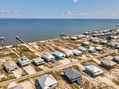 Fall in love with this gorgeous beach house situated on on Isle Dauphine Club Golf Course in Alabama - for sale on GolfHomes.com, golf home, golf lot