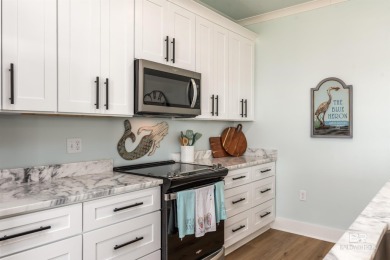 Fall in love with this gorgeous beach house situated on on Isle Dauphine Club Golf Course in Alabama - for sale on GolfHomes.com, golf home, golf lot