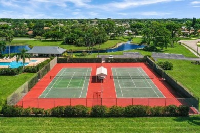 Enjoy panoramic lake and golf course views from this well on Heritage Ridge Golf Club in Florida - for sale on GolfHomes.com, golf home, golf lot