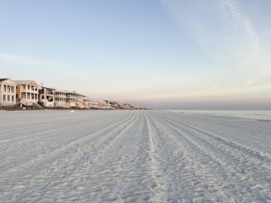 Stunning home just steps from the Gulf in Carillon Beach! This on Sharks Tooth Golf Club in Florida - for sale on GolfHomes.com, golf home, golf lot