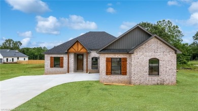 This charming 3-bedroom, 2-bathroom home by K.C. Colley on Vache-Grasse Country Club in Arkansas - for sale on GolfHomes.com, golf home, golf lot