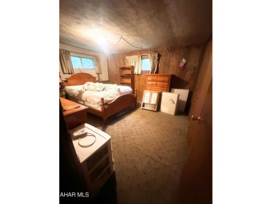 Located on a sprawling one-acre lot, this bi-level home offers on Iron Masters Country Club in Pennsylvania - for sale on GolfHomes.com, golf home, golf lot