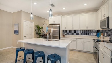 Prepare to be the envy of Lakewood Ranch! This stunning End-Unit on Tatum Ridge Golf Links in Florida - for sale on GolfHomes.com, golf home, golf lot