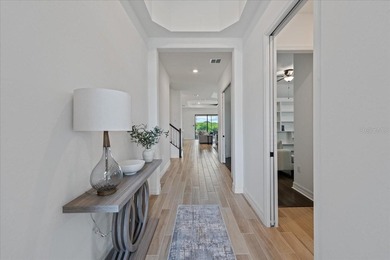 Golf, water, and sunrise views with true backyard privacy! Built on Lakewood National Golf Club in Florida - for sale on GolfHomes.com, golf home, golf lot