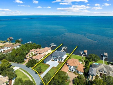 480 Captains Circle is an extraordinary waterfront estate within on Regatta Bay Golf and Country Club in Florida - for sale on GolfHomes.com, golf home, golf lot