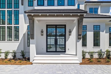 480 Captains Circle is an extraordinary waterfront estate within on Regatta Bay Golf and Country Club in Florida - for sale on GolfHomes.com, golf home, golf lot