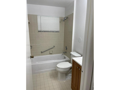 Beautiful corner unit on the 1st floor in beautiful Cypress at on Woodmont Country Club in Florida - for sale on GolfHomes.com, golf home, golf lot