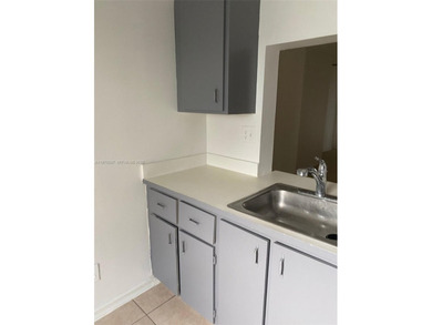 Beautiful corner unit on the 1st floor in beautiful Cypress at on Woodmont Country Club in Florida - for sale on GolfHomes.com, golf home, golf lot