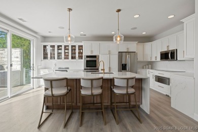 Nestled in the coveted Black Hawk Estates on a scenic bluff with on Seasons Ridge At Four Seasons in Missouri - for sale on GolfHomes.com, golf home, golf lot