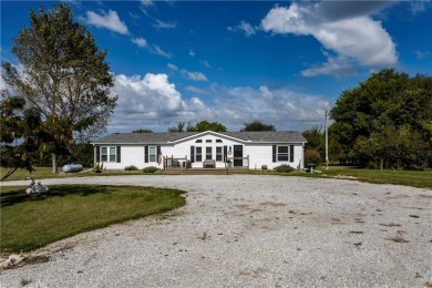 Come fall in love with this beautifully maintained five-lot on Linn Valley Lakes - Deer Trace Golf Course in Kansas - for sale on GolfHomes.com, golf home, golf lot
