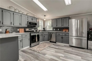 Come fall in love with this beautifully maintained five-lot on Linn Valley Lakes - Deer Trace Golf Course in Kansas - for sale on GolfHomes.com, golf home, golf lot