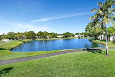 BEAUTIFUL AND BRIGHT GROUND FLOOR TOWNHOUSE. QUICK WALK TO THE on Boca West Golf and Country Club in Florida - for sale on GolfHomes.com, golf home, golf lot