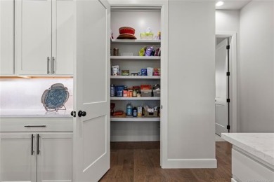 Welcome to your luxury retreat--this nearly new one-story home on The Patriot in Oklahoma - for sale on GolfHomes.com, golf home, golf lot
