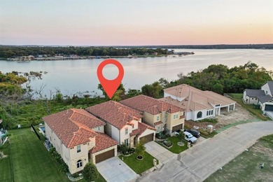 Experience luxury lakeside living in this beautiful home on The Golf Club at Resort Eagle Mountain Lake in Texas - for sale on GolfHomes.com, golf home, golf lot