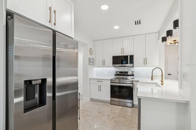 Welcome home to laid-back coastal living in the heart of Dunedin on The Dunedin Country Club in Florida - for sale on GolfHomes.com, golf home, golf lot