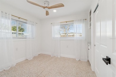 Welcome home to laid-back coastal living in the heart of Dunedin on The Dunedin Country Club in Florida - for sale on GolfHomes.com, golf home, golf lot