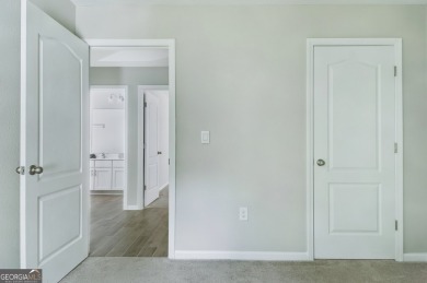 WELCOME TO THIS NEARLY NEW FOUR-BEDROOM, THREE-CAR GARAGE HOME on The Club At Osprey Cove in Georgia - for sale on GolfHomes.com, golf home, golf lot