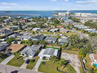 Welcome home to laid-back coastal living in the heart of Dunedin on The Dunedin Country Club in Florida - for sale on GolfHomes.com, golf home, golf lot